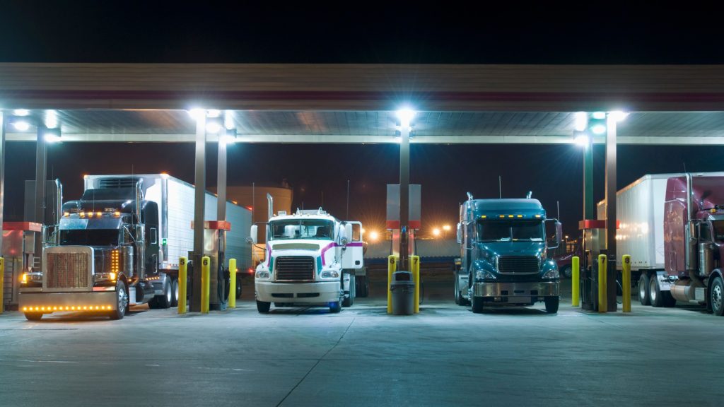 Semi trucks parked at a truck stop